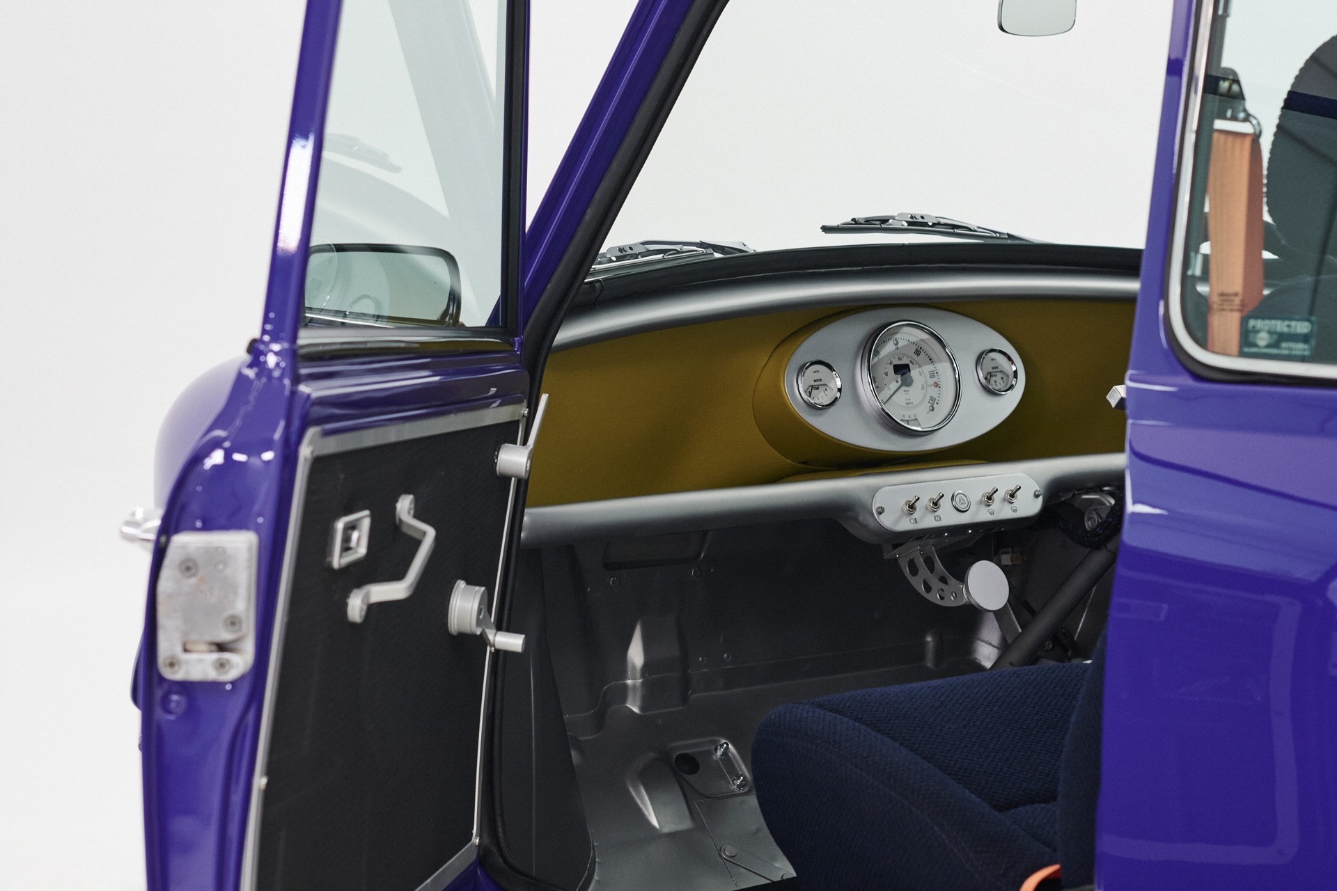 Inside view of the open MINI Recharged model with a view of the dashboard.